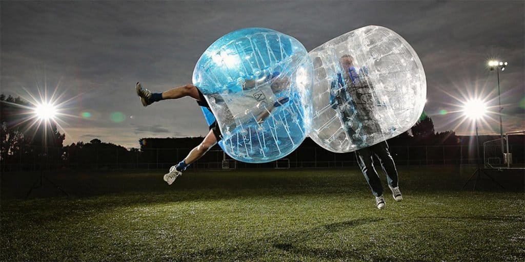 People playing bubble soccer